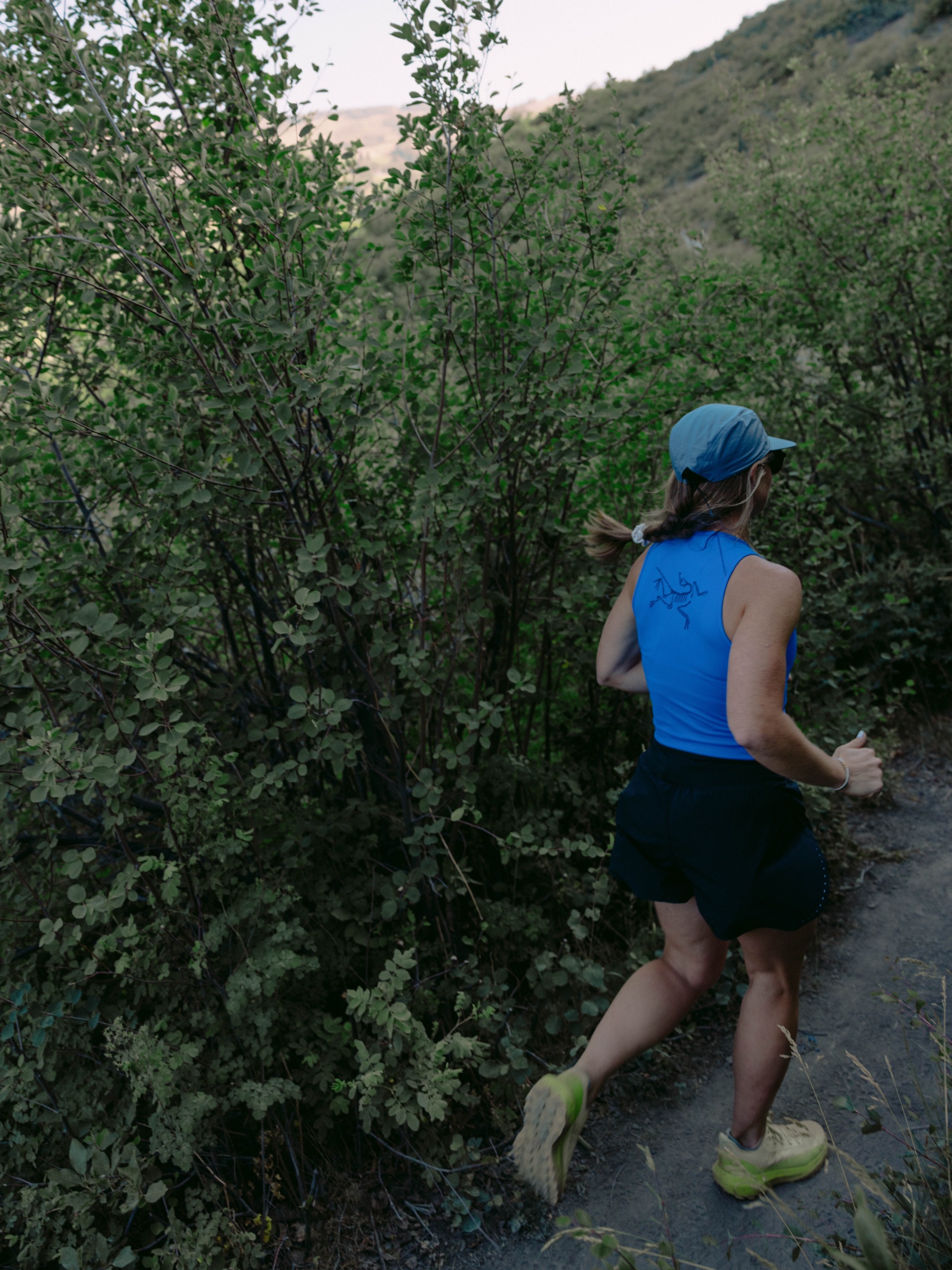 Model in Arc'teryx gear in Colorado mountain terrain
